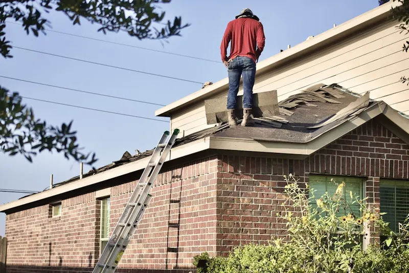 Professional roofer working on a residential roof in Lankershim